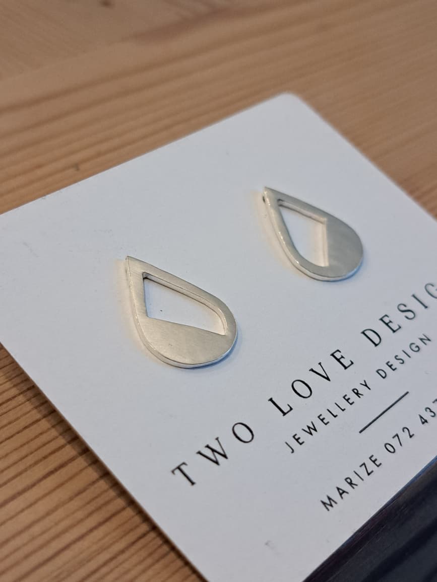 Sterling_Silver_cut_out_Teardrop Sterling silver cut-out teardrop stud earrings - half-filled teardrop with triangular cutout by Two Love Design
