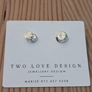 Sterling silver nugget stud earrings shown on jewellery card - one-of-a-kind hand-cast pair